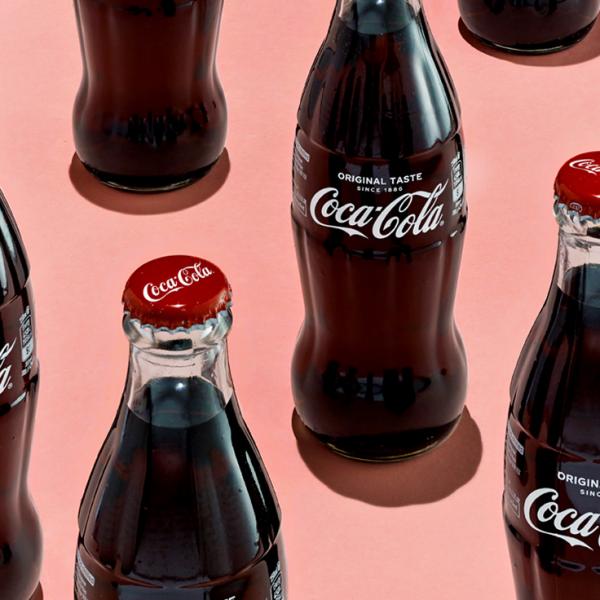 coke bottles on pink background